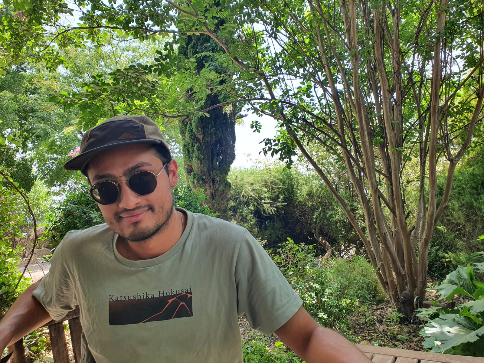 Portrait of Nischal Mainali in a garden